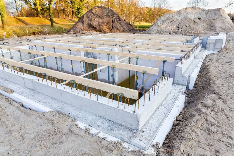 Construction site with foundation for new house - Rscwp Construction site with foundation for new house